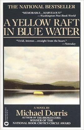 A YELLOW RAFT IN BLUE WATER